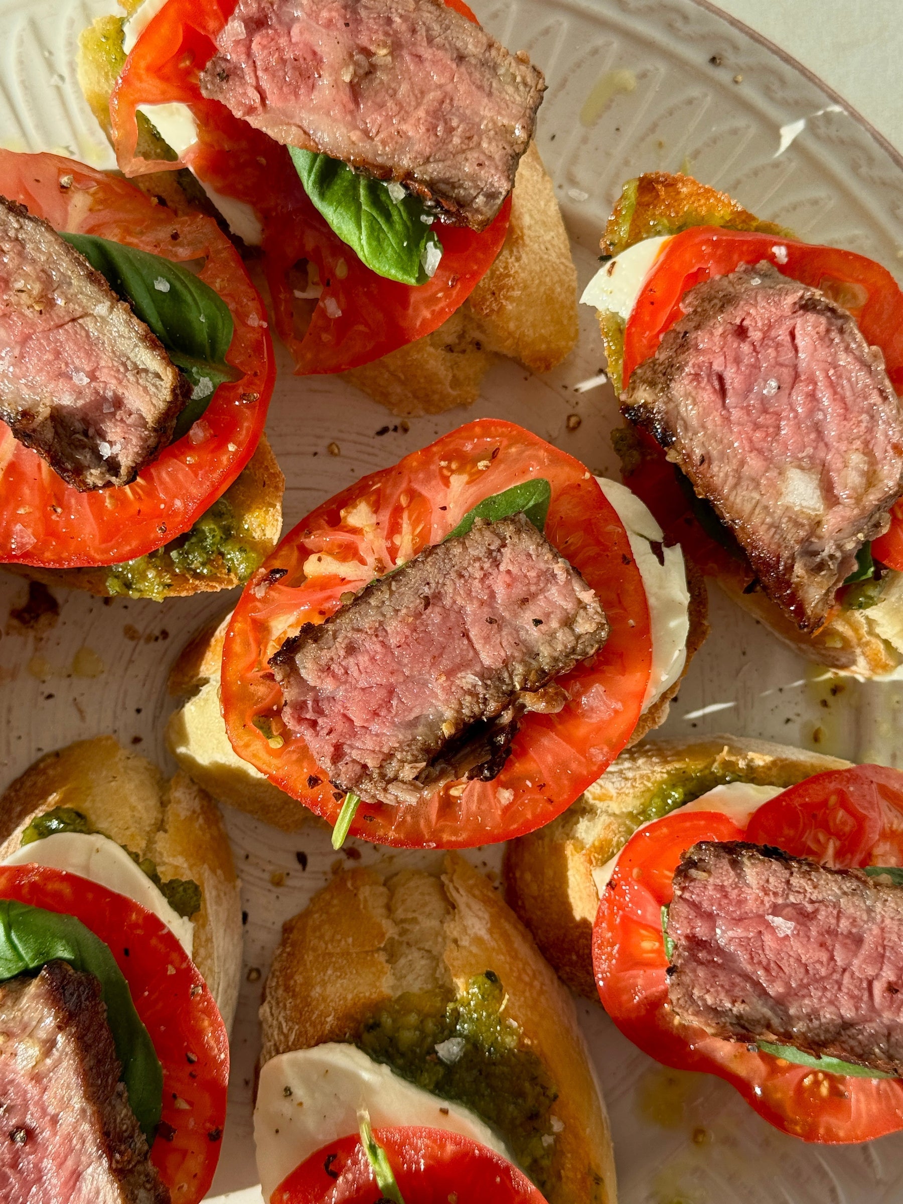 Caprese Pesto Steak Crostini