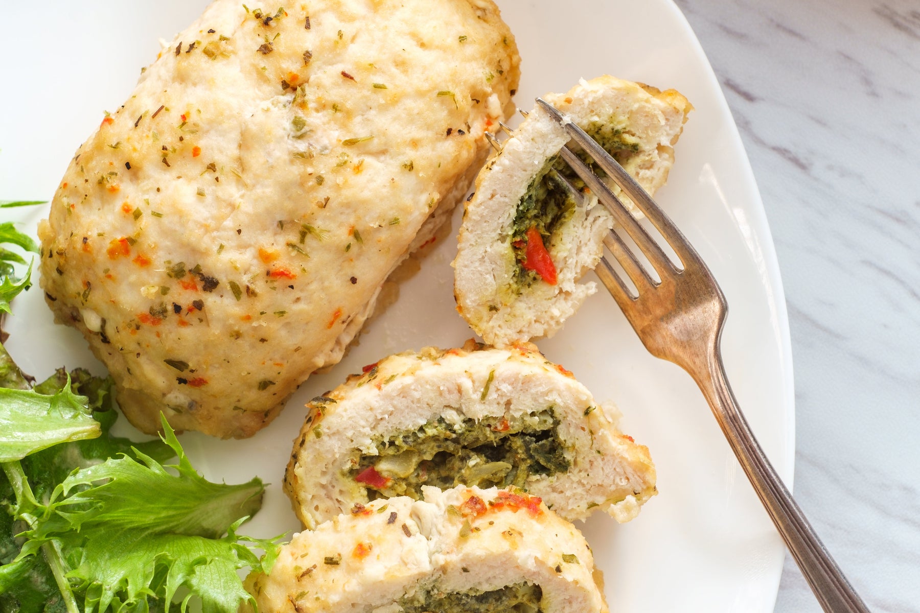 Spinach Artichoke Stuffed Chicken with Creamy Sauce