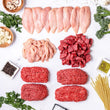 The Essentials Box includes free range chicken breasts, sliced chicken, locally sourced steak tips, and ground beef. Here is a layout of all those cuts, with mushrooms, herbs, spices, garlic, olive oil, salt, and uncooked pasta surrounding it.