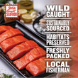 Six Wild Caught Salmon filets next to text stating that the wild-caught seafood box is sustainably sourced, freshly packed, and never harms habitats by working with local fisherman.